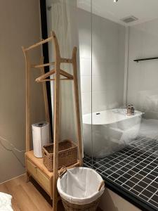 a bathroom with a bath tub and a sink at The Heritage 1937 in Kuching
