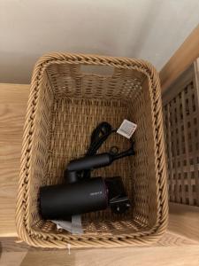a wicker basket with a hair dryer in it at The Heritage 1937 in Kuching
