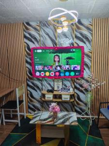 a computer monitor on a wall in a room at Ciel's Haven free Dinner Silog Meals in Binangonan