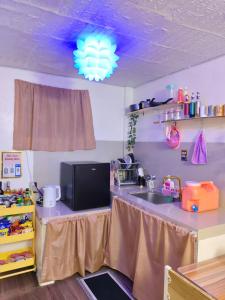 a kitchen with a counter top with a sink and a counter top at Ciel's Haven free Dinner Silog Meals in Binangonan