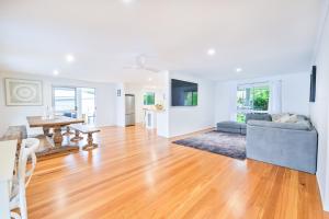 a living room with a couch and a table at River Shack Ballina 