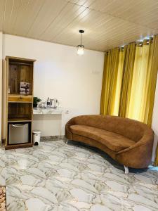 a living room with a large couch in a room at The Bliss Ella in Ella