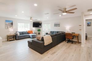 a living room with a couch and a table at Dennison House in Three Rivers