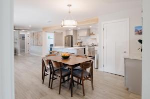 a kitchen and dining room with a table and chairs at Dennison House in Three Rivers +13 photos