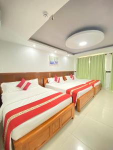 Cette chambre spacieuse comprend 2 lits. dans l'établissement Khách Sạn Quốc Cường-Dì Tám, à Vung Tau