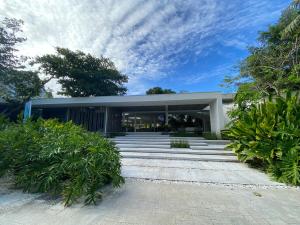 a building with a lot of stairs in front of it at 1 Bedroom Suite at Tambuli Seaside Resort -Cebu in Maribago