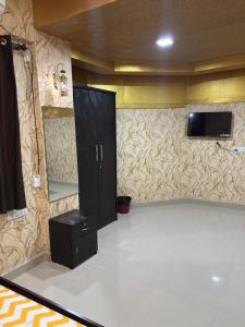 Televisyen dan/atau pusat hiburan di KORAMANGALA Suites +84 gambar