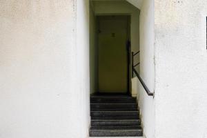 a hallway with stairs leading into a building at Collection O Viviana Mall Thane West Formerly Athithi Stays in Thane