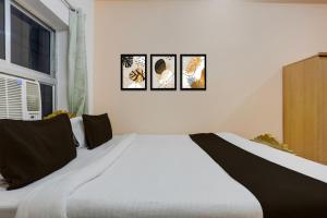 Ένα ή περισσότερα κρεβάτια σε δωμάτιο στο Super Hotel O Patliputra Golambar +22 φωτογραφίες