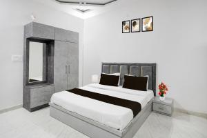 Postel nebo postele na pokoji v ubytování Super Hotel O Blue World Theme Park Formerly Hotel Mandhana