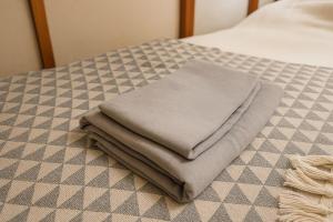 Ένα ή περισσότερα κρεβάτια σε δωμάτιο στο Usami Seaside +25 φωτογραφίες