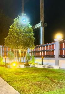 a building with a tree in front of a building at lalinkan poolvilla 