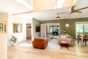 a living room with a couch and a table at Creek Haven in Bright