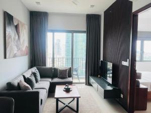 a living room with a couch and a tv at Colombo, Trizen Luxury Apartments, Sri Lanka in Colombo