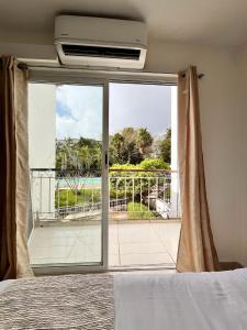 Ένα ή περισσότερα κρεβάτια σε δωμάτιο στο Villas Cozumel con alberca