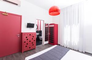 Säng eller sängar i ett rum på Il Giglio Rosso B&B