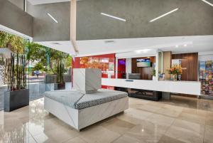 a lobby with a reception desk in a building at Reflection on the Sea in Gold Coast