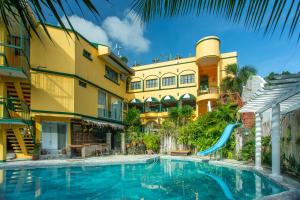 a swimming pool in front of a building at Yahweh's Spring Retreat and Resort in Calamba