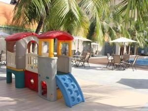 a toy train is sitting next to a pool at NARITA Classic Hotel in Surabaya
