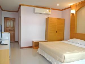 Un ou plusieurs lits dans un hébergement de l'établissement Baan Ingna Resort Hotel