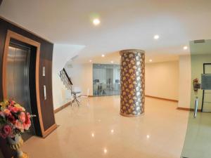 a lobby with a column in the middle of a building at The Y Residence in Chiang Mai