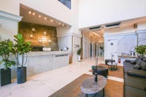 a lobby of a building with a counter and a table at Hotel Morning Calm in Osal-li