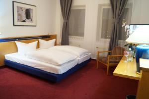 Postel nebo postele na pokoji v ubytování Hotel Rahlstedter Hof