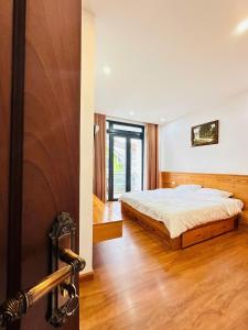 Postel nebo postele na pokoji v ubytování MIM Homestay