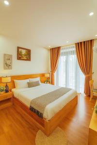 Postel nebo postele na pokoji v ubytování MIM Homestay