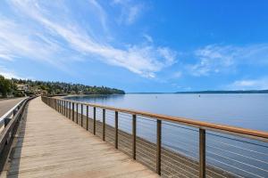 a wooden boardwalk next to a body of water at Water View Retreat Near Beach Park & City in Redondo