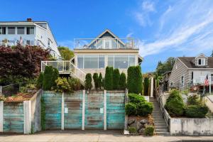 a house with a gate in front of it at Water View Retreat Near Beach Park & City in Redondo +55 photos