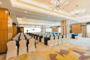 a large room with a bunch of chairs in it at Grand Soluxe Zhongyou Hotel Shenzhen in Shenzhen