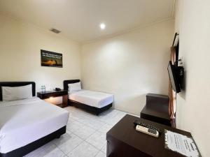 TV a/nebo společenská místnost v ubytování Mahkota Hotel