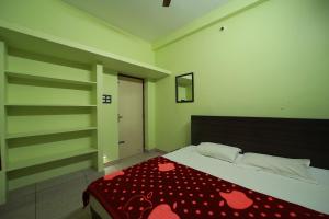 Ένα ή περισσότερα κρεβάτια σε δωμάτιο στο De Capella Homestay