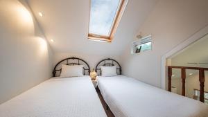 Postel nebo postele na pokoji v ubytování Private Emotional Stay Gangneungchae