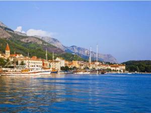 a group of boats docked in a body of water at Apartments Kata - Studio Apartment in Makarska