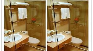 two pictures of a bathroom with a sink and a toilet at GreenTree Inn Shanghai South Railway Station Xujiahui Stadium Subway Station Shell Hotel in Shanghai +41 photos