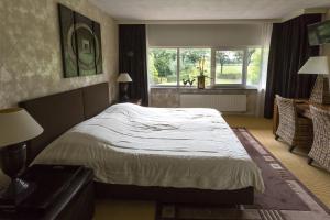 Una habitación en Villa het Bascour