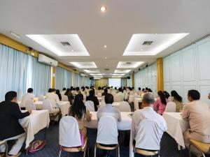 a group of people sitting in chairs in a room at Lake Inn Hotel in Songkhla