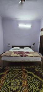 Ένα ή περισσότερα κρεβάτια σε δωμάτιο στο Hotel The Sun N Moon