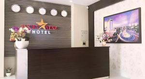 a hotel lobby with a sign for a hotel at LUCKY STAR HOTEL in Buon Ma Thuot +31 photos