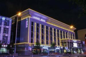 a large building with lights on it at night at Lavande Hotel Tianjin Binhia Yujiabao Finance Center Branch in Binhai