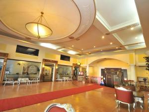 Restaurant ou autre lieu de restauration dans l'établissement Queen Margarette Hotel