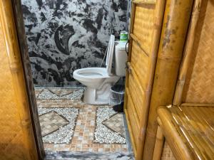 a bathroom with a toilet in a room at Khaosok August Freedom Camp in Khao Sok +155 photos