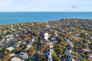 an aerial view of a city with the ocean at Idyllic Aireys Retreat - where ocean & hills meet in Aireys Inlet