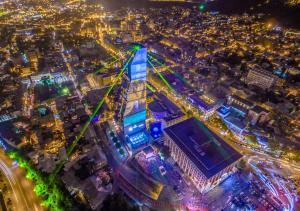 an aerial view of a city at night at The Biltmore Tbilisi Hotel in Tbilisi City
