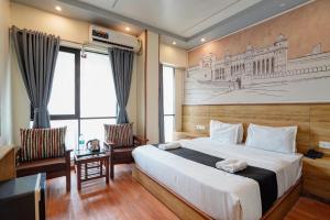 Ένα ή περισσότερα κρεβάτια σε δωμάτιο στο Hotel Riddhi Siddhi Vile Parle