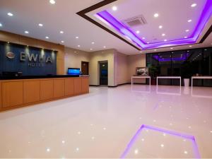 a lobby with a hotel with purple lights at Ewha Hotel in Jeju