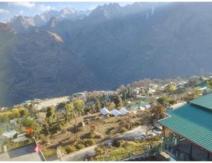an aerial view of a town with mountains in the background at Nk brothers,Joshimath in Joshīmath