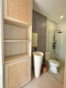 a bathroom with a toilet and a sink in it at Villa Kelle - Uluwatu Nusa Dua in Nusa Dua +33 photos